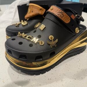 MCM Black and Gold Clogs with Tan Accents